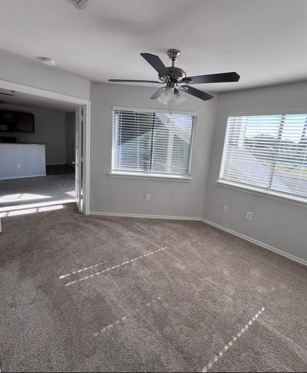 9837 Walnut Street, Unit 305 Dallas, TX 75243 - Photo 8 of 10 a view of an empty room with a window