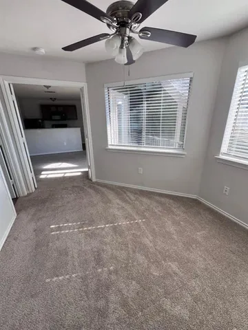 a view of empty room with windows