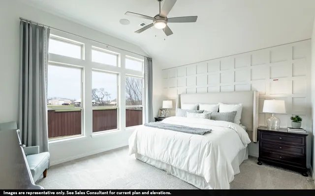 a bedroom with a large bed and a view of bedroom