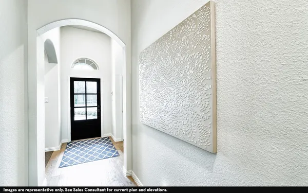 a view of room with window and hallway