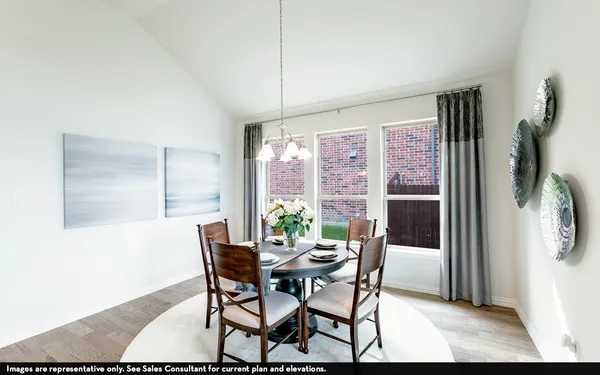 a view of a dining room with furniture and a window