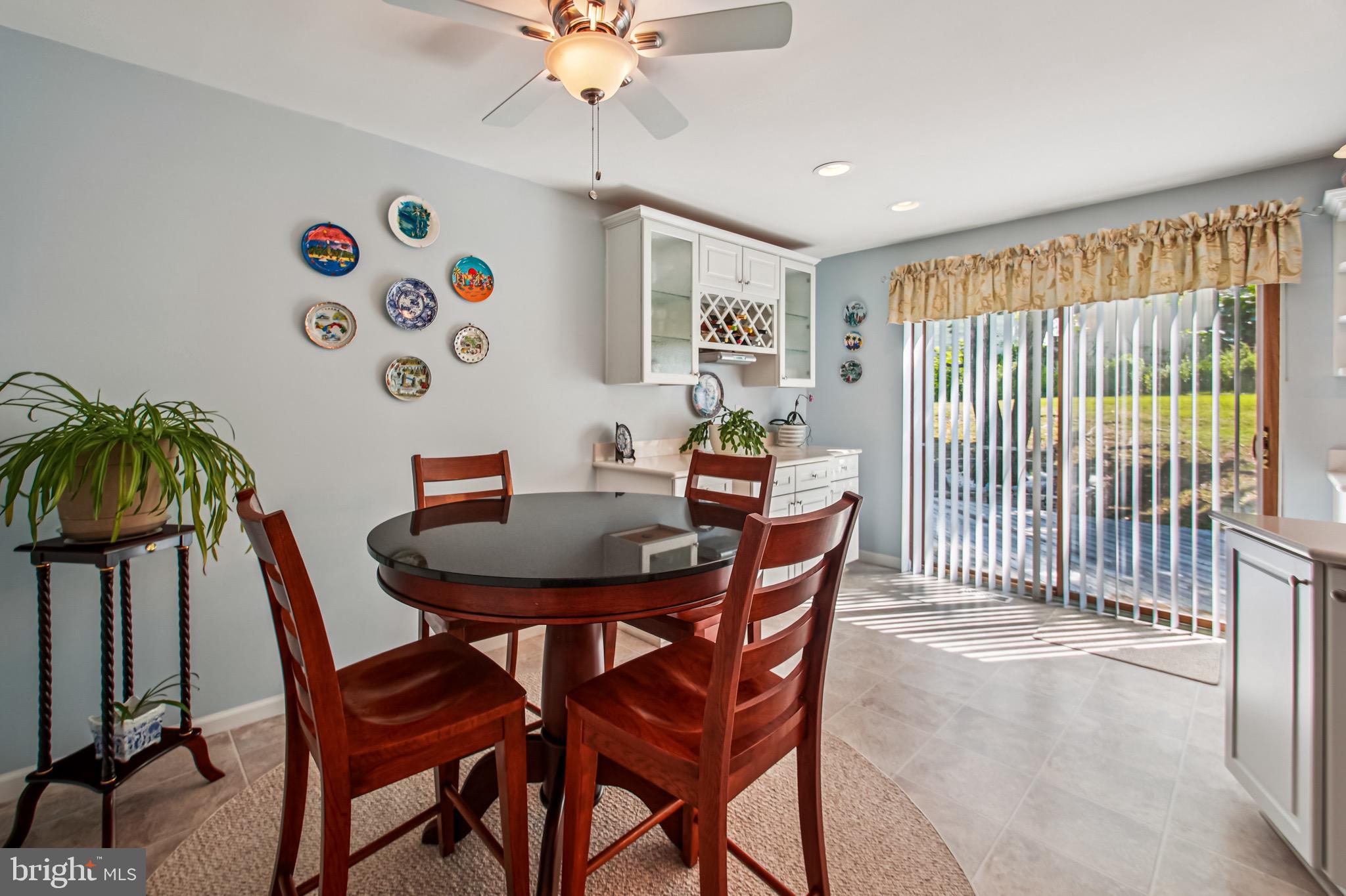 8113 Callo Lane Rosedale, MD 21237 - Photo 12 of 32 a view of a dining room with furniture and chandelier