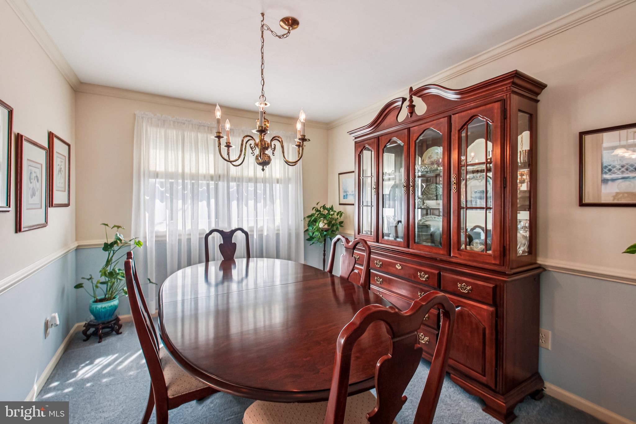 8113 Callo Lane Rosedale, MD 21237 - Photo 13 of 32 a view of a dining room with furniture window and wooden floor