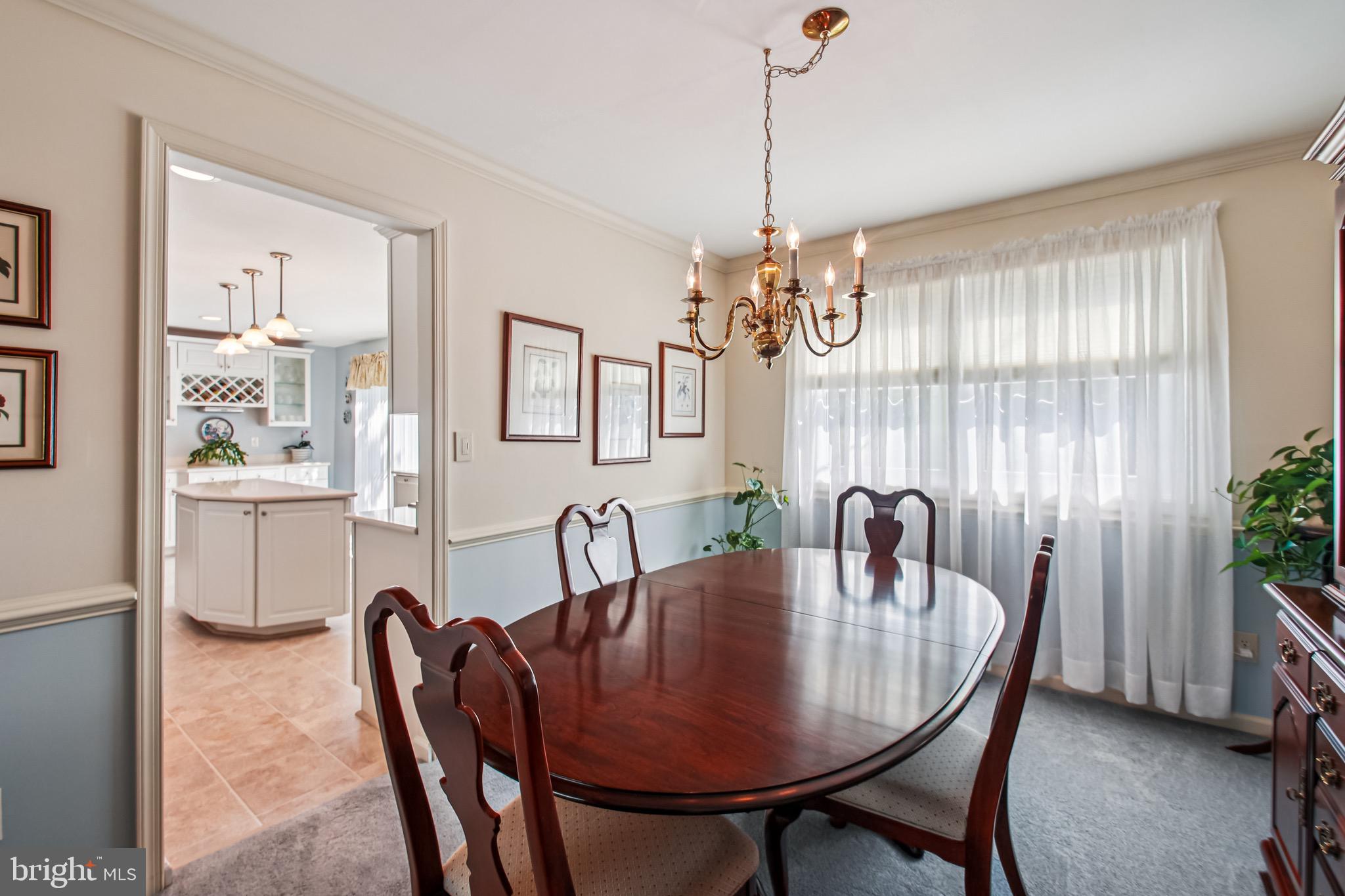 8113 Callo Lane Rosedale, MD 21237 - Photo 14 of 32 a view of a dining room with furniture window and wooden floor