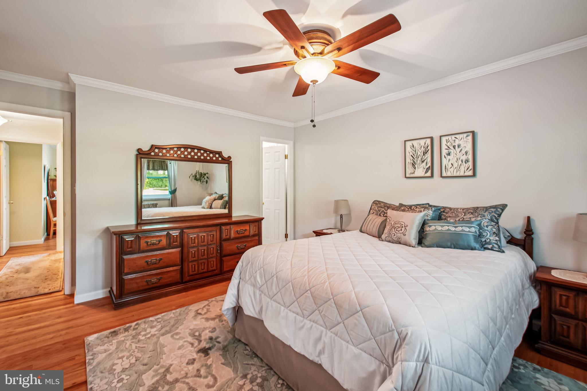 8113 Callo Lane Rosedale, MD 21237 - Photo 17 of 32 a bedroom with a bed and a dresser