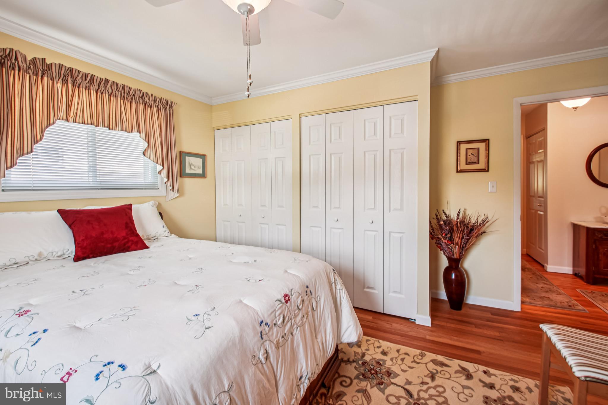 8113 Callo Lane Rosedale, MD 21237 - Photo 21 of 32 a bedroom with a large bed and a window