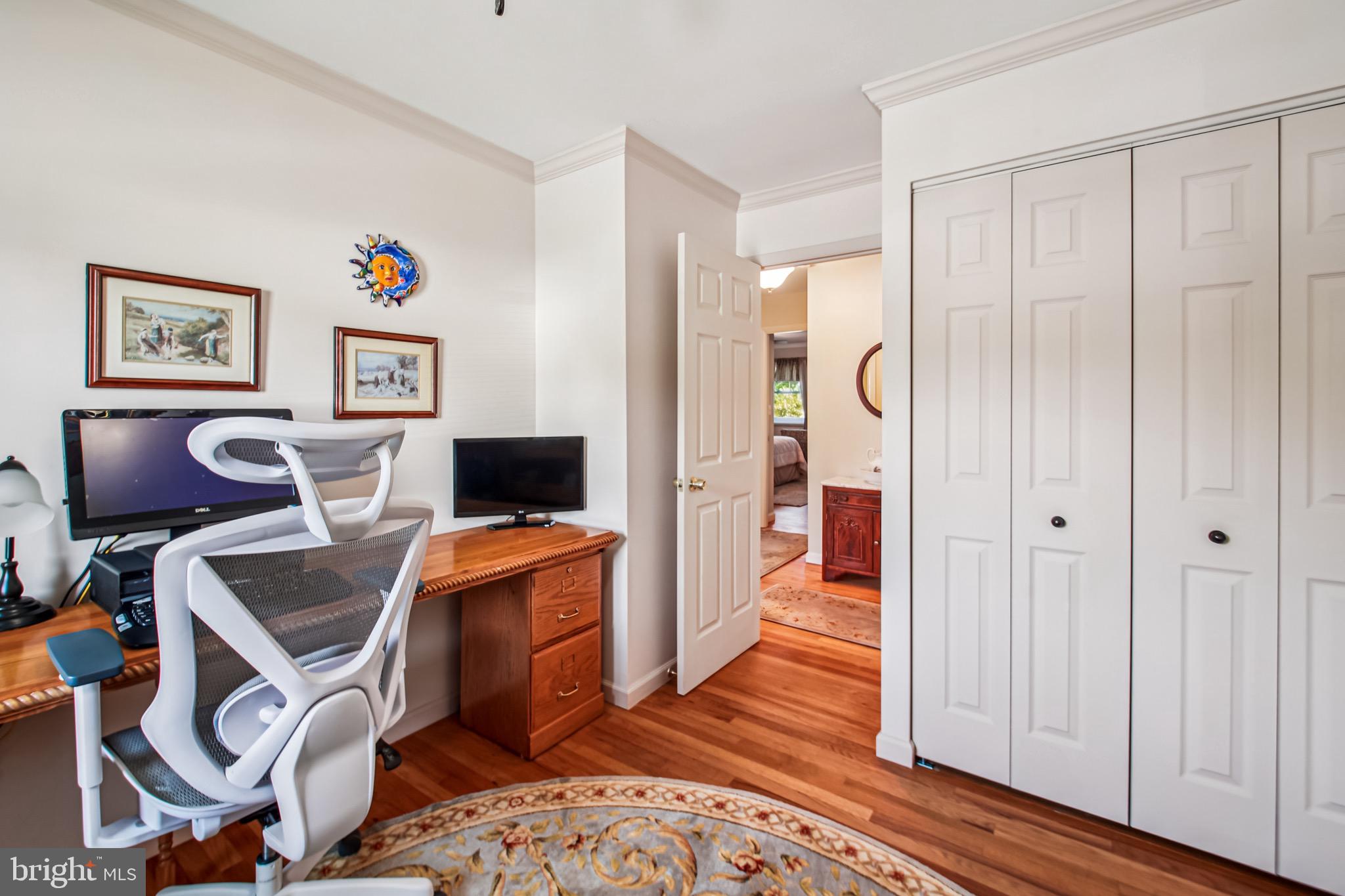 8113 Callo Lane Rosedale, MD 21237 - Photo 23 of 32 a workspace with furniture and wooden floor
