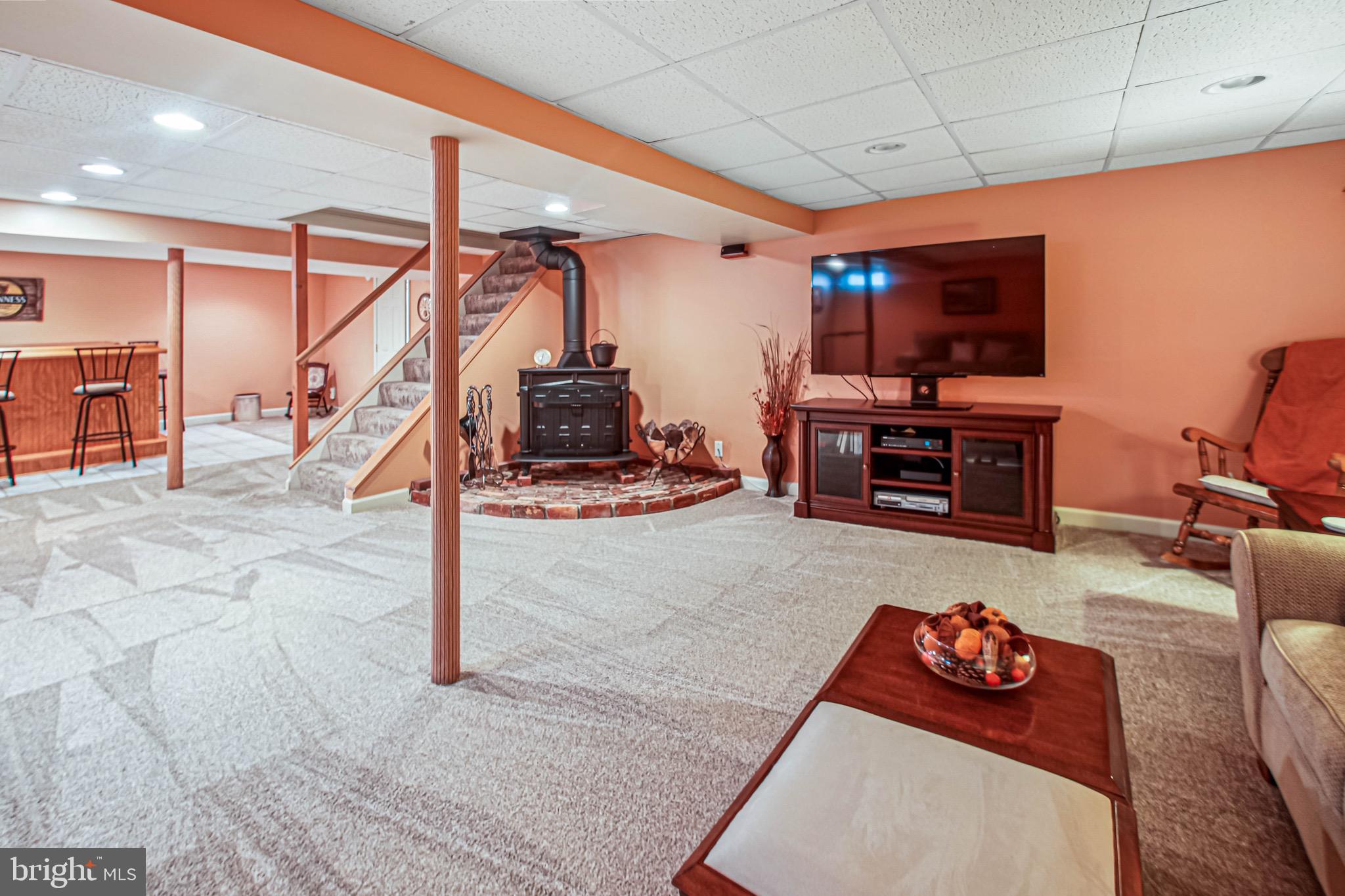 8113 Callo Lane Rosedale, MD 21237 - Photo 28 of 32 a living room with furniture and a flat screen tv