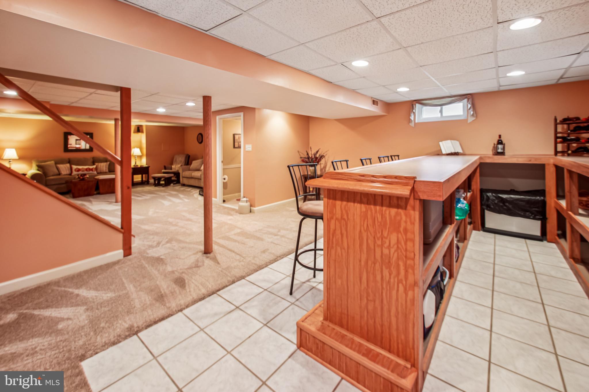 8113 Callo Lane Rosedale, MD 21237 - Photo 30 of 32 a utility room with stainless steel appliances kitchen island granite countertop a large counter top and a stove