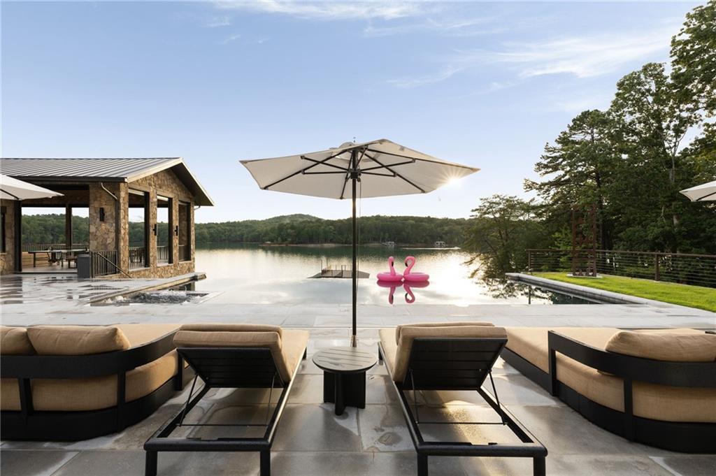 725 Rocky Point Drive Morganton, GA 30560 - Photo 141 of 157 a view of a patio with swimming pool table and chairs