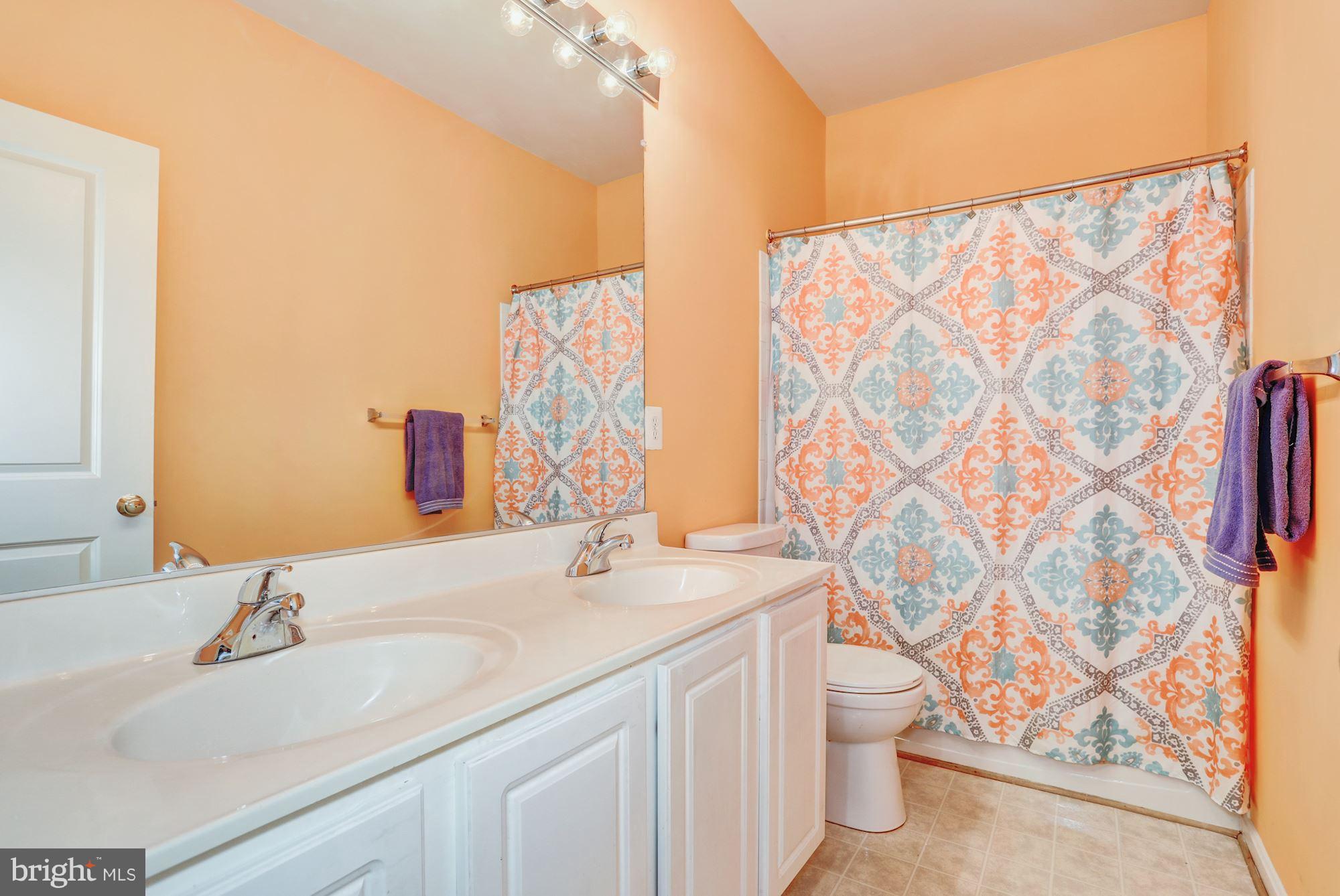 9029 Roaring Spring Loop Bristow, VA 20136 - Photo 24 of 28 Upstairs hall bathroom