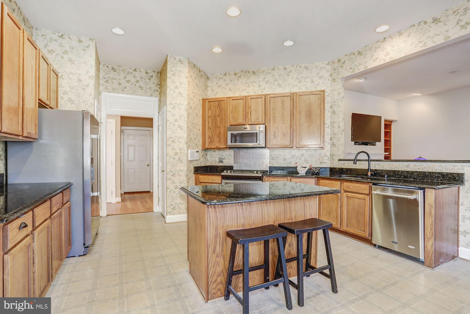 9029 Roaring Spring Loop Bristow, VA 20136 - Photo 6 of 28 Expansive kitchen with island and pantry