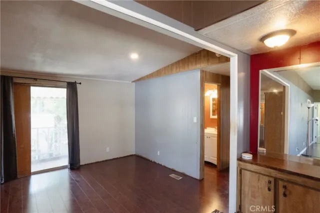 a view of a room with a flat screen tv