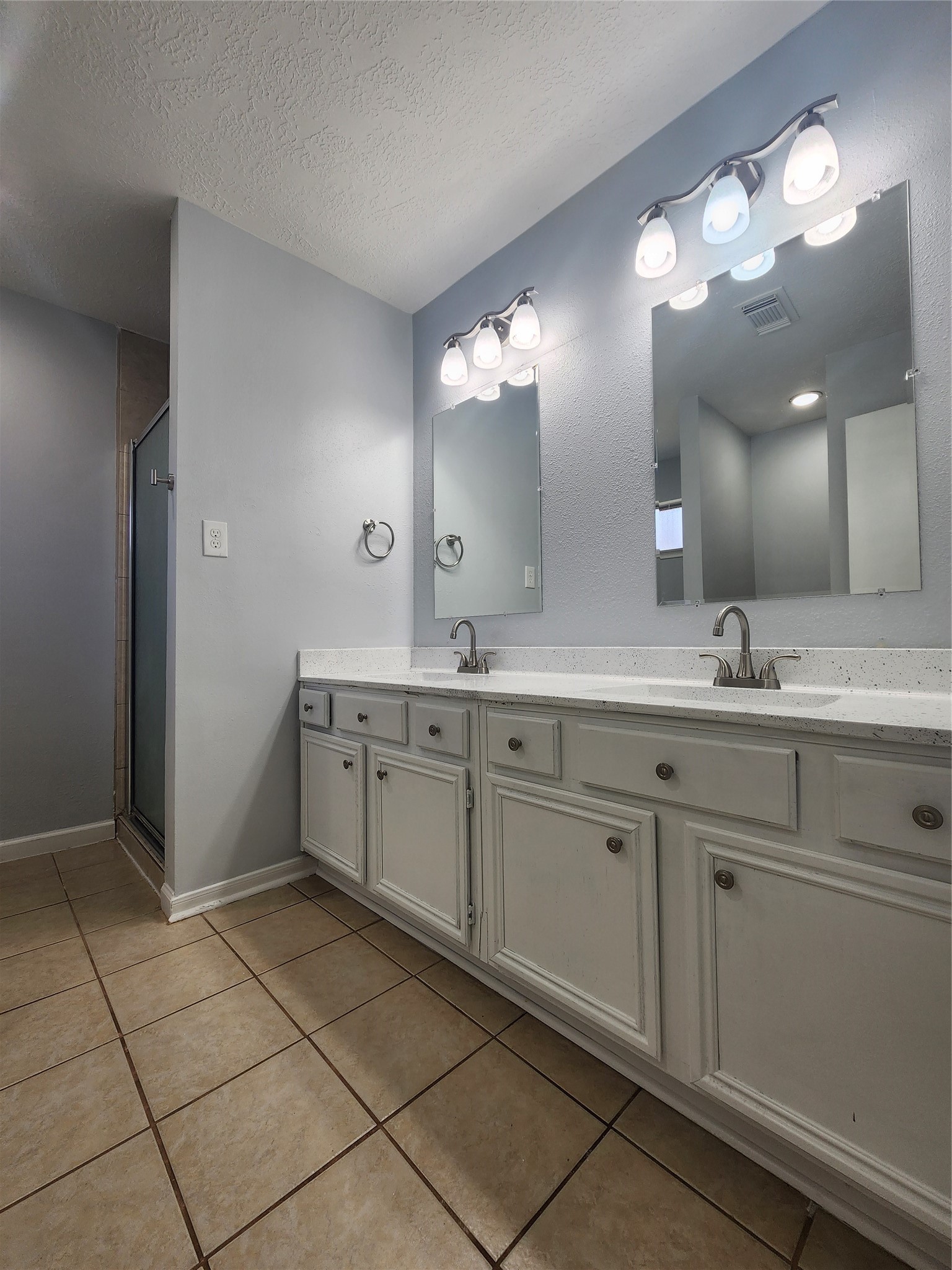 5507 Clarkston Lane Spring, TX 77379 - Photo 13 of 25 a spacious bathroom with a double vanity sink mirror and shower