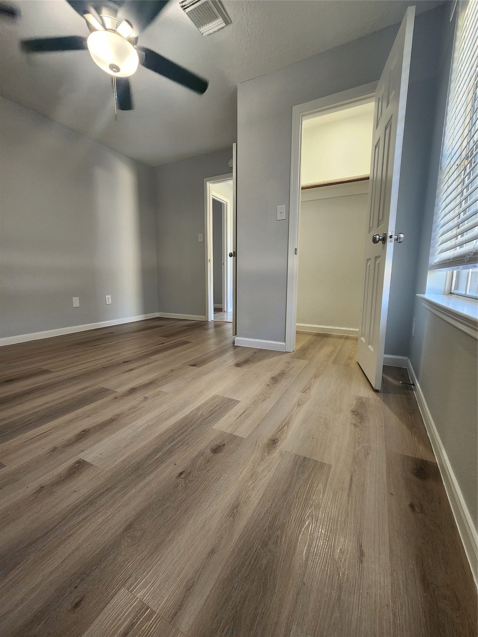 5507 Clarkston Lane Spring, TX 77379 - Photo 16 of 25 wooden floor in an empty room with a window