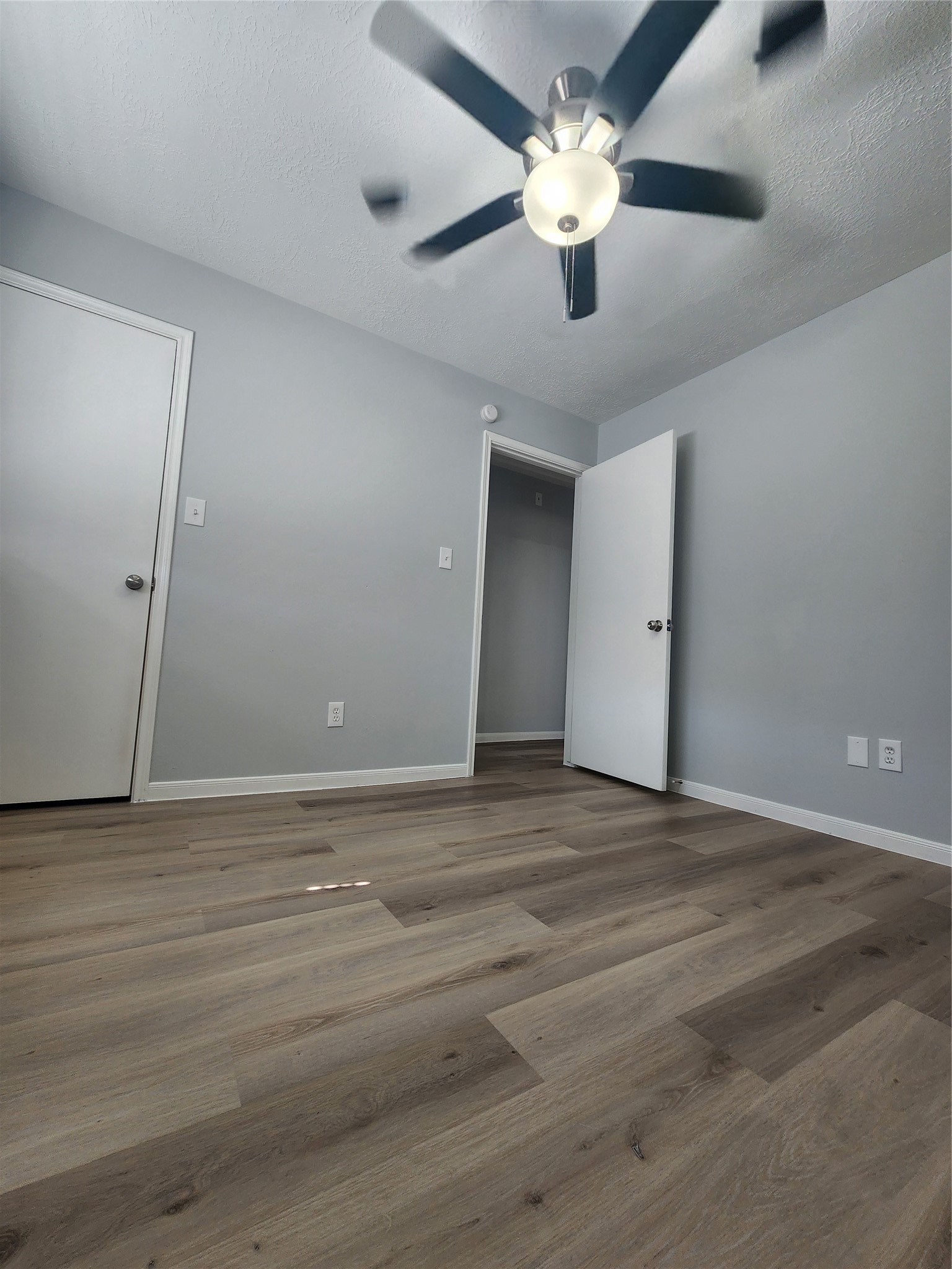 5507 Clarkston Lane Spring, TX 77379 - Photo 17 of 25 a view of an empty room with a chandelier fan