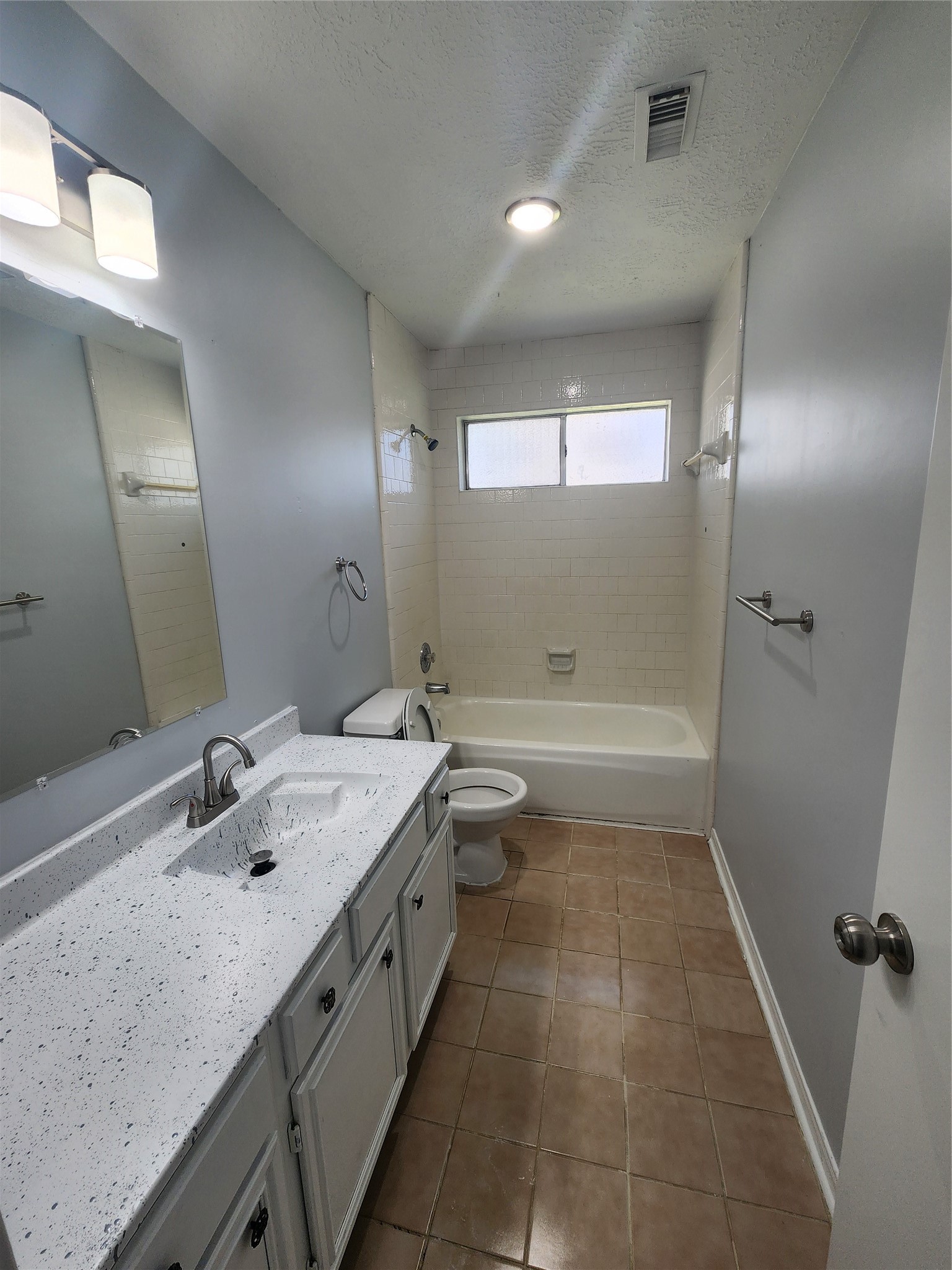5507 Clarkston Lane Spring, TX 77379 - Photo 18 of 25 a bathroom with a granite countertop sink a toilet a mirror and shower