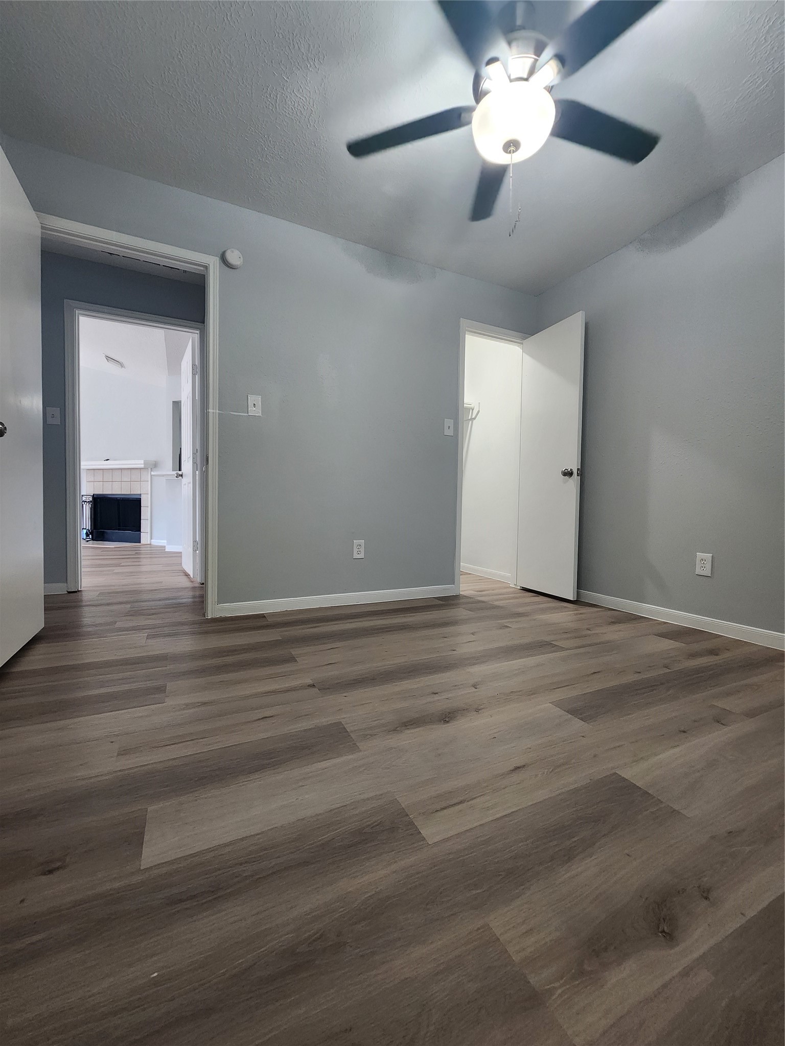 5507 Clarkston Lane Spring, TX 77379 - Photo 20 of 25 a view of a livingroom with a ceiling fan and hardwood floor