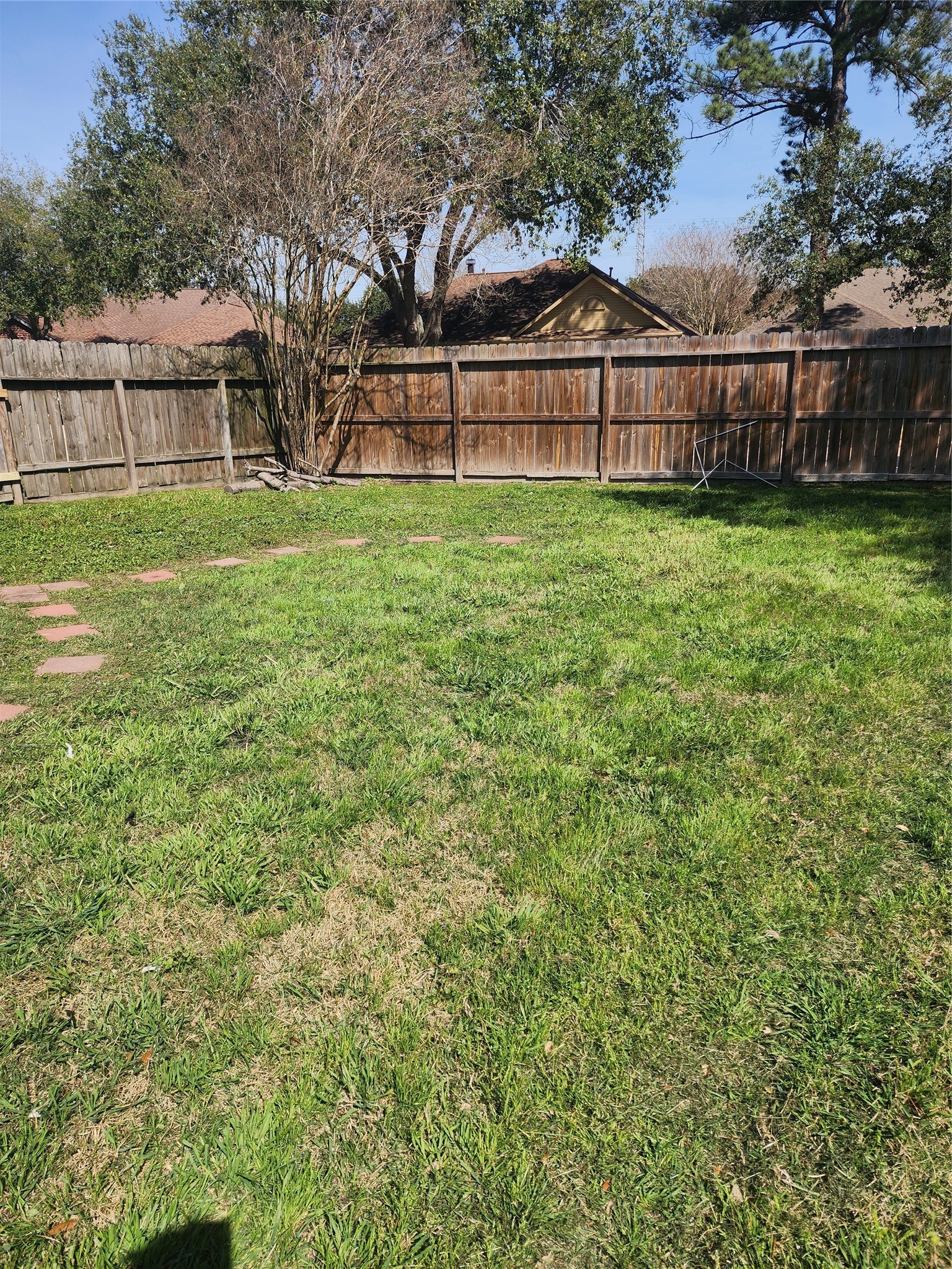 5507 Clarkston Lane Spring, TX 77379 - Photo 23 of 25 a view of a yard with large trees and wooden fence