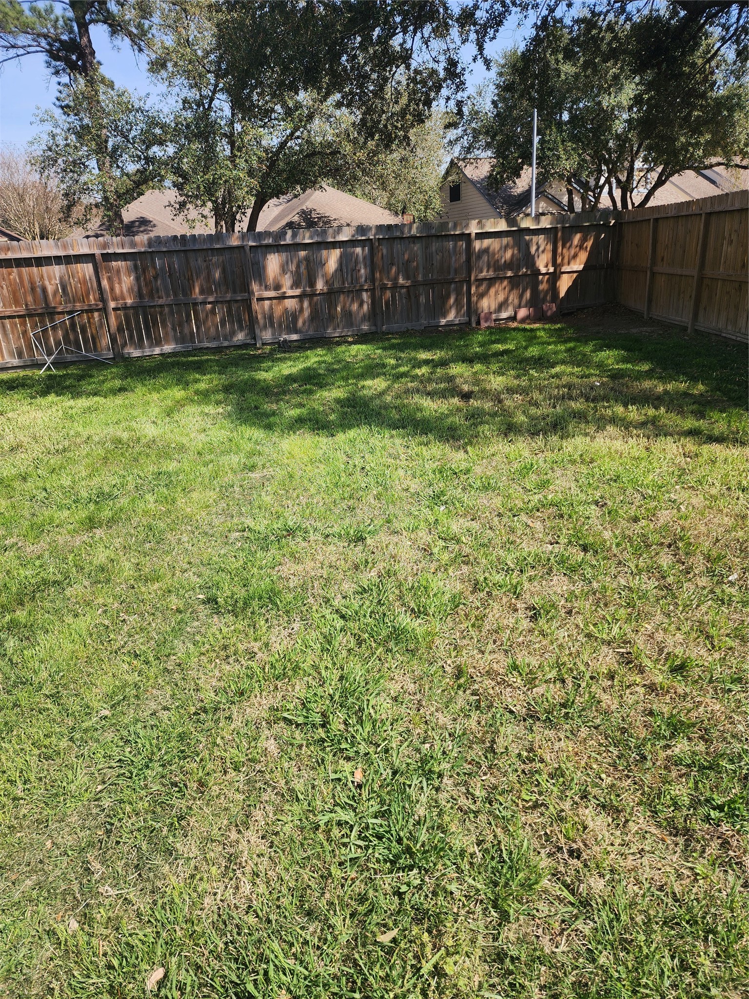 5507 Clarkston Lane Spring, TX 77379 - Photo 24 of 25 a view of a backyard with wooden fence and a bench