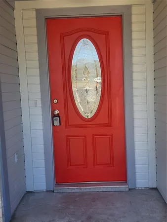 a front view of a house with a wooden door