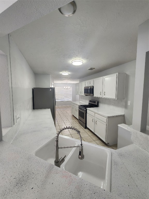 5507 Clarkston Lane Spring, TX 77379 - Photo 6 of 25 a kitchen with a sink cabinets and counter space