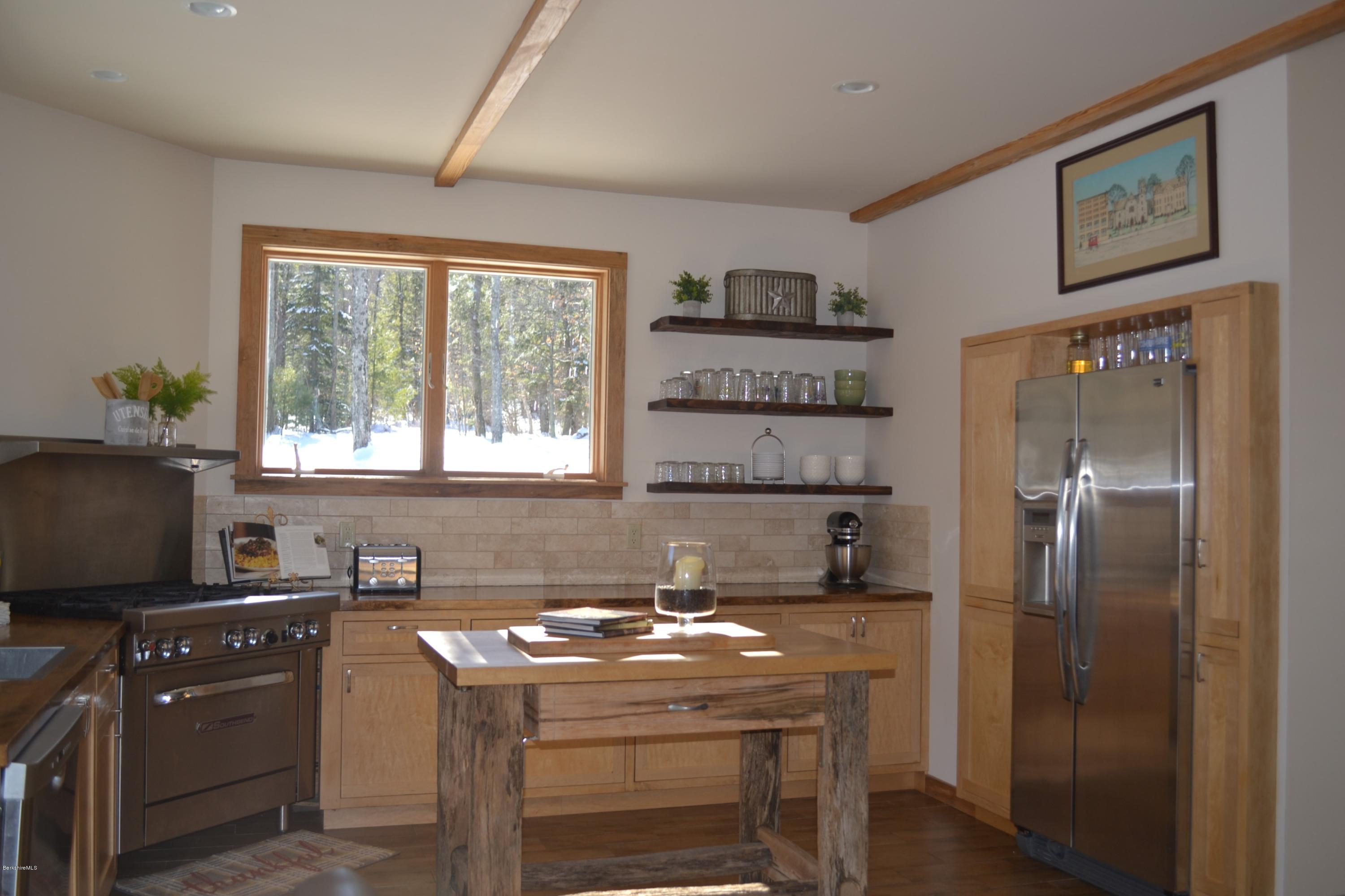 301 Frost Road Washington, MA 01223 - Photo 14 of 31 a kitchen with a stove a refrigerator and a stove top oven