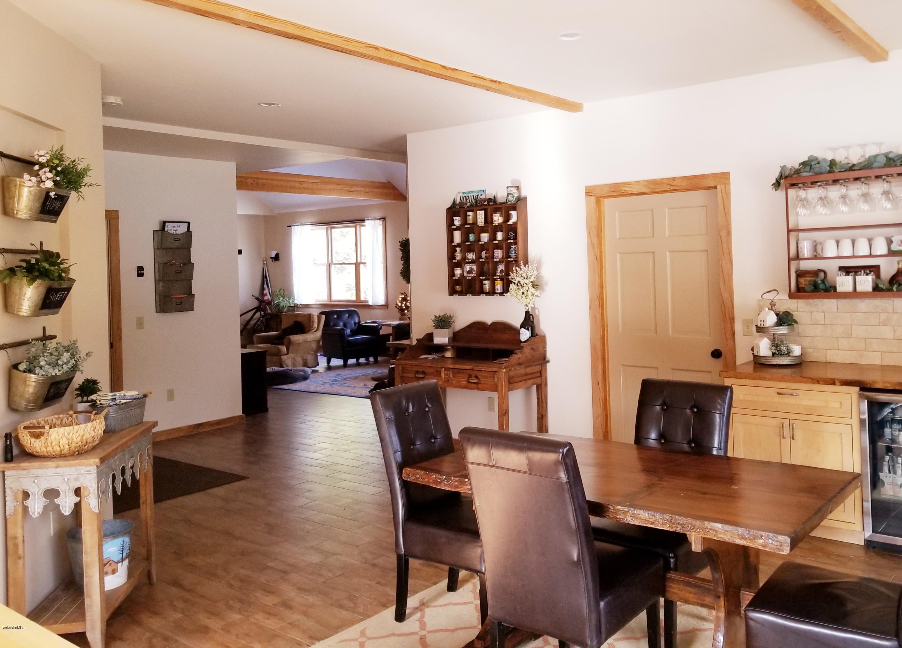 301 Frost Road Washington, MA 01223 - Photo 16 of 31 a view of a dining room with furniture and chandelier