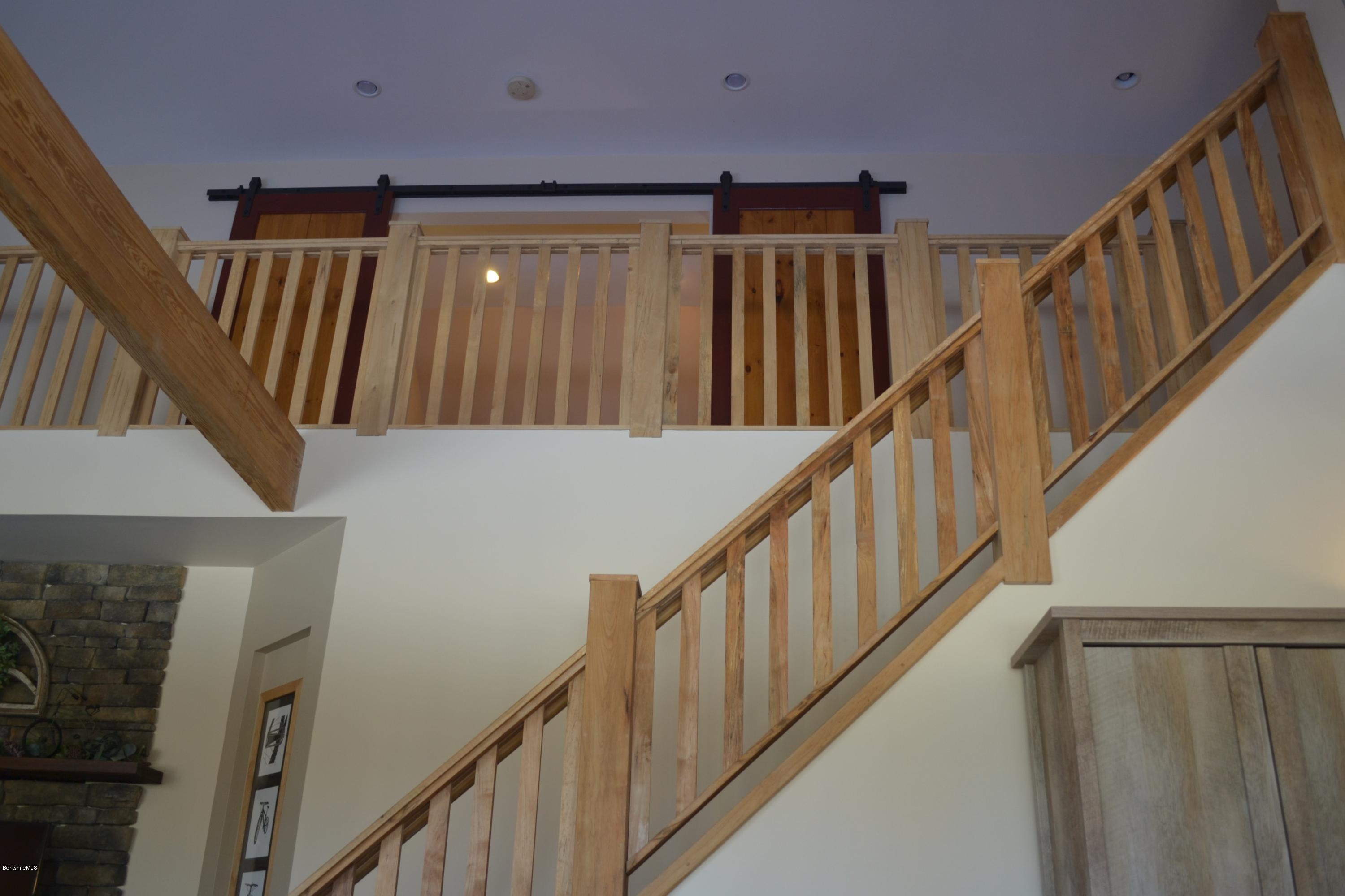 301 Frost Road Washington, MA 01223 - Photo 18 of 31 a view of staircase with wooden floor and stairs