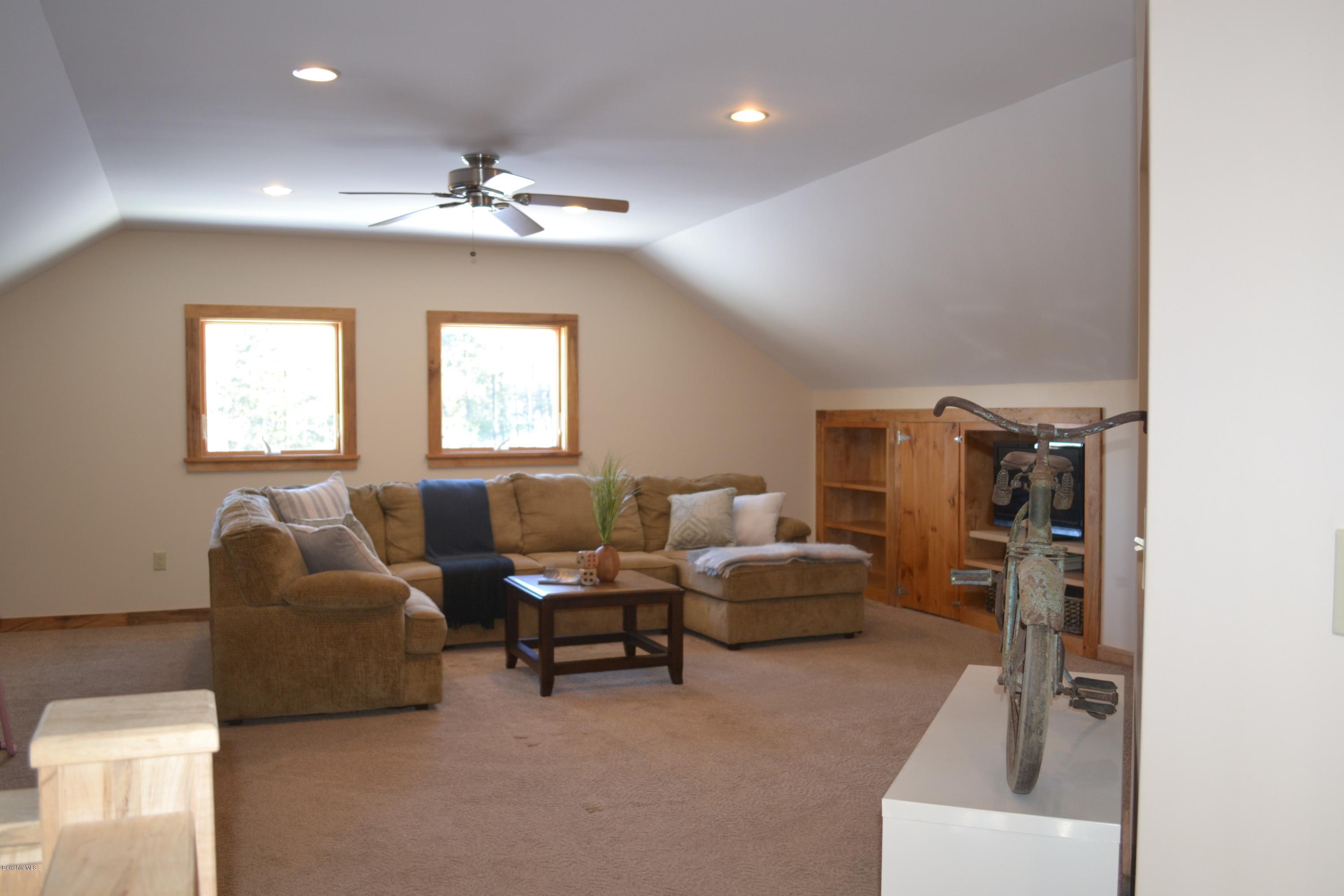301 Frost Road Washington, MA 01223 - Photo 20 of 31 a living room with furniture and a chandelier