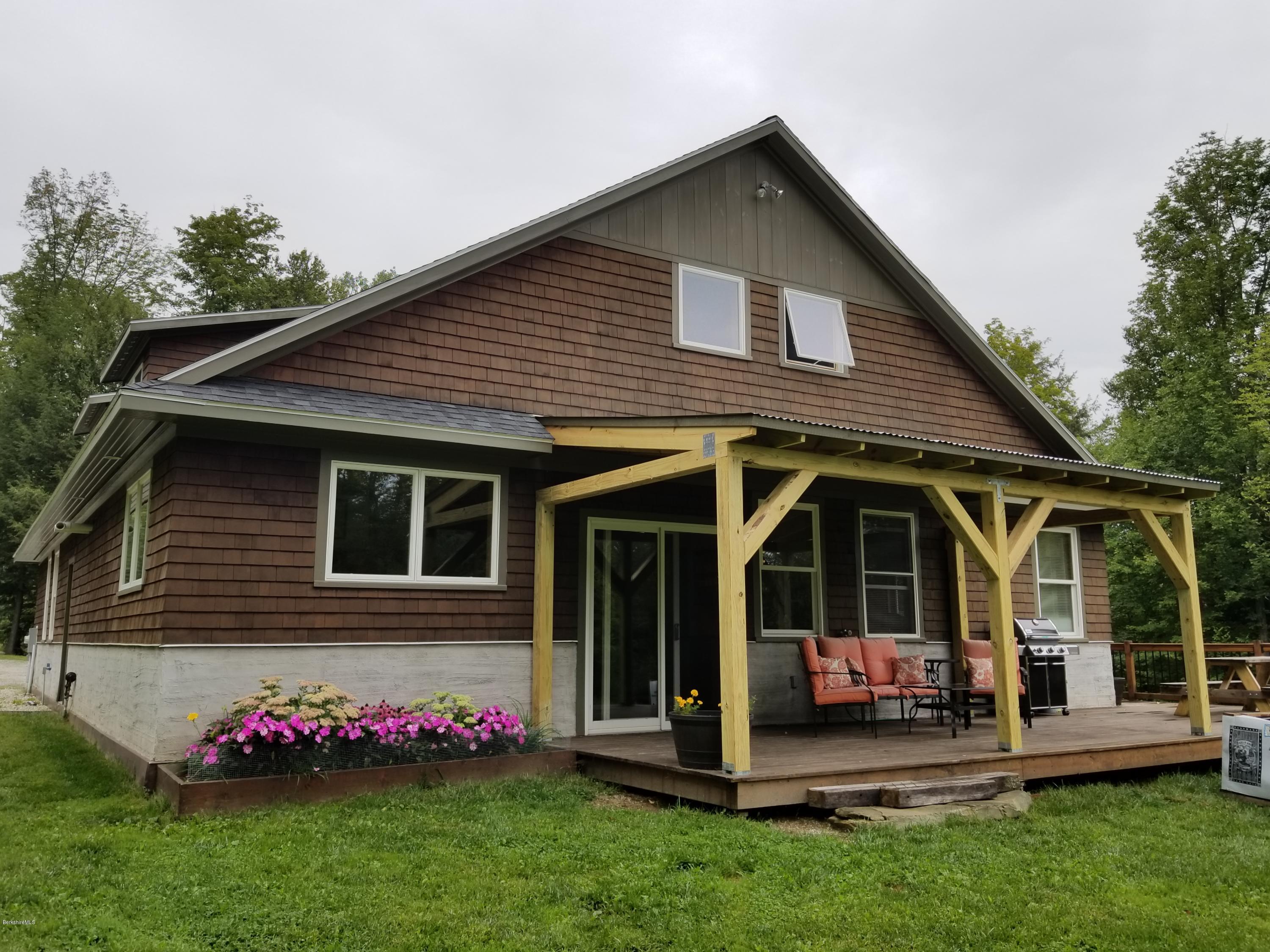 301 Frost Road Washington, MA 01223 - Photo 3 of 31 a front view of house with an outdoor seating