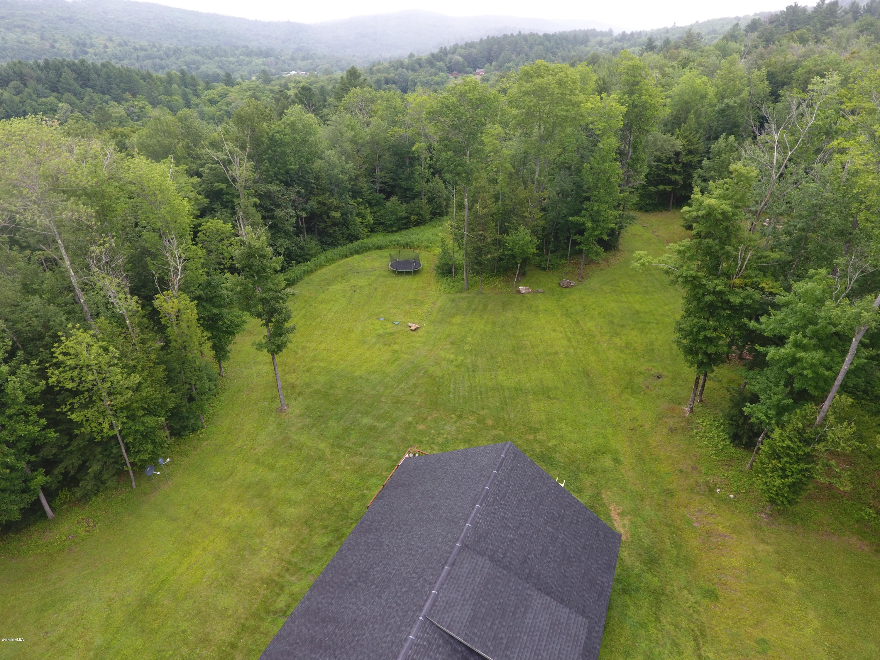 301 Frost Road Washington, MA 01223 - Photo 26 of 31 a view of a green yard with large trees