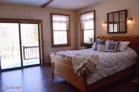 301 Frost Road Washington, MA 01223 - Photo 9 of 31 a bedroom with a large bed and a large window