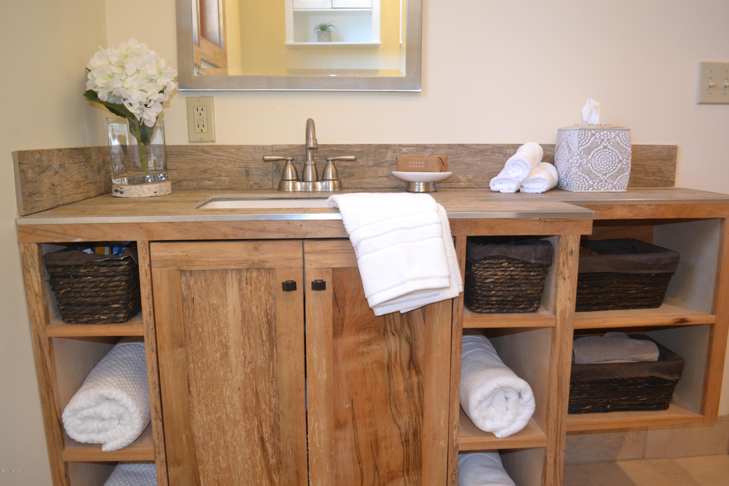 301 Frost Road Washington, MA 01223 - Photo 10 of 31 a bathroom with a sink and a mirror