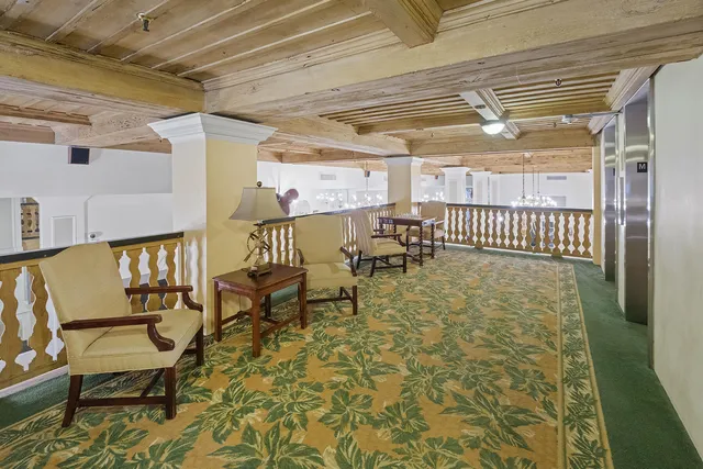 a dining room with furniture and chandelier