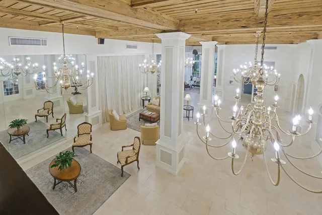 a living room with lots of books