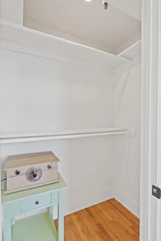 a bedroom with a bed and a utility room with dryer and washer
