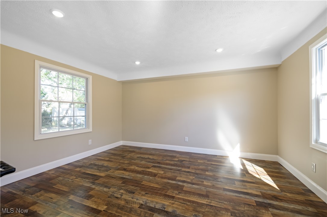 3716 Rolliston Road Cleveland, OH 44120 - Photo 7 of 37 Empty room featuring dark wood-type flooring and recessed lighting