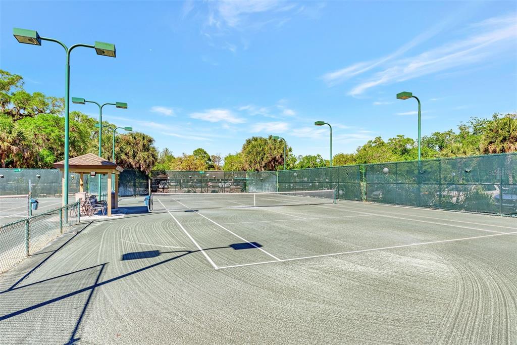 5103 Greencroft Road Sarasota, FL 34235 - Photo 23 of 25 a view of a tennis court