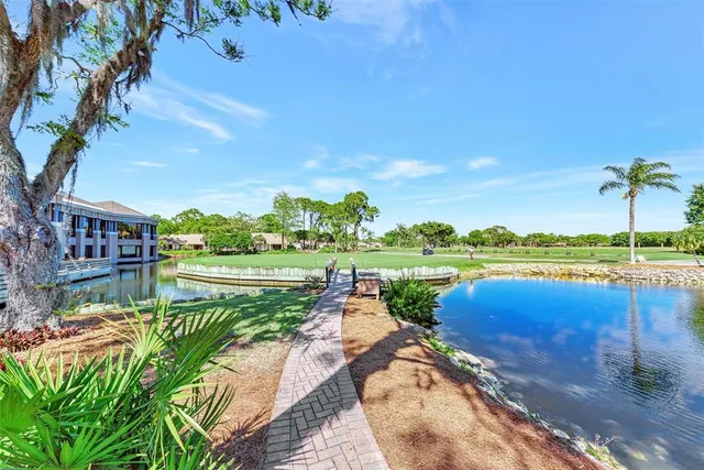 a view of a garden with flowers and trees