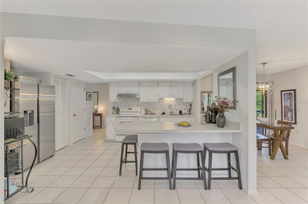 5103 Greencroft Road Sarasota, FL 34235 - Photo 4 of 25 a view of a dining room with furniture