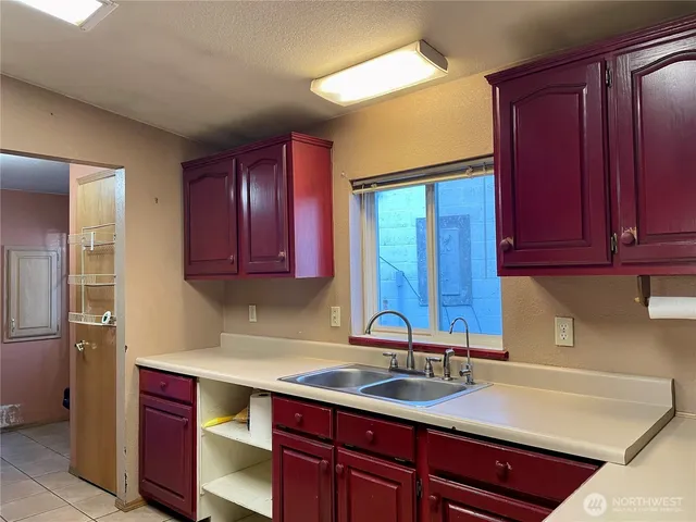 a kitchen with a sink and cabinets