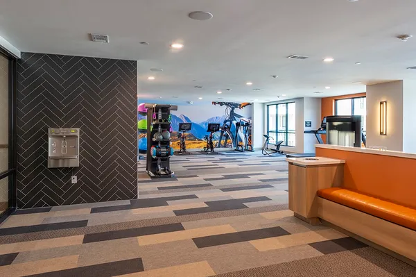 a view of a lobby with black carpet