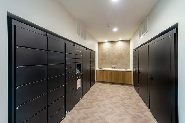 a bathroom with glass door shower and a sink