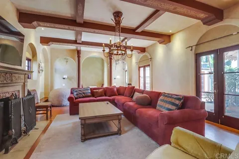 a view of a dining room with furniture wooden floor and chandelier