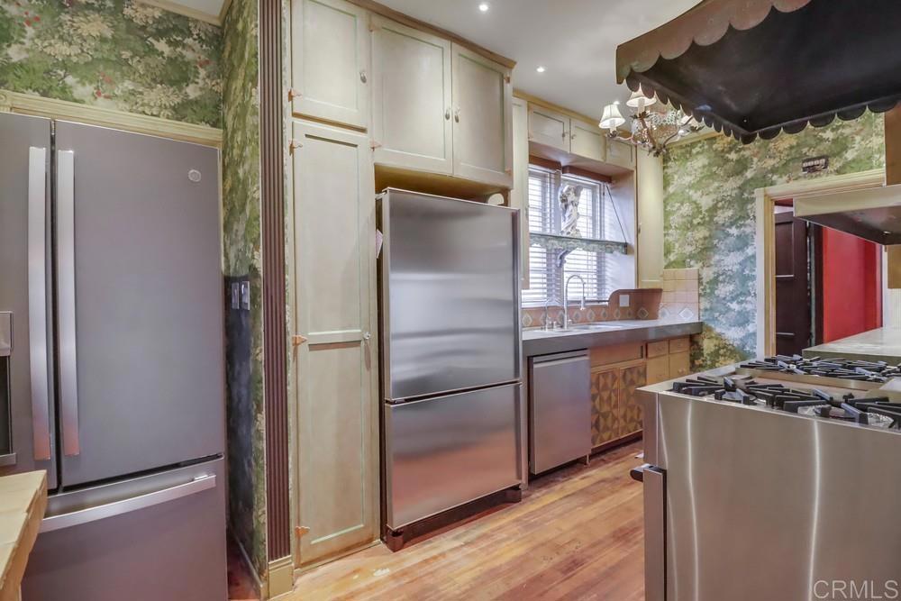 3014 Xenophon Street San Diego, CA 92106 - Photo 19 of 73 a kitchen with stainless steel appliances granite countertop a refrigerator and a stove