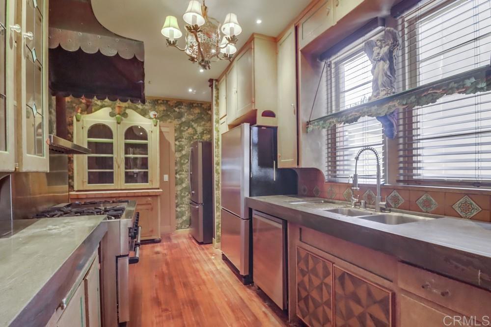 3014 Xenophon Street San Diego, CA 92106 - Photo 21 of 73 a spacious bathroom with a granite countertop double vanity sink a mirror and a shower