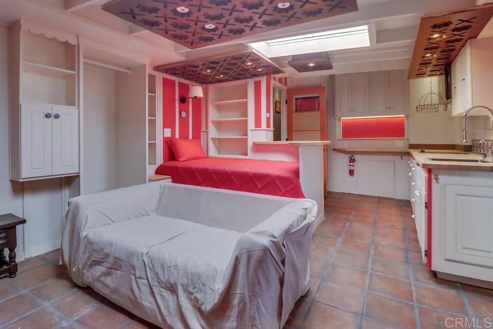 3014 Xenophon Street San Diego, CA 92106 - Photo 29 of 73 a bed room with a bed and a window