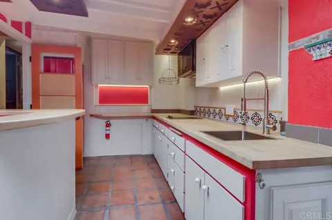 a bathroom with a sink a mirror and a bathtub