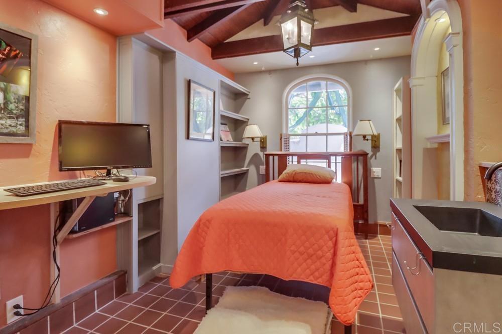 3014 Xenophon Street San Diego, CA 92106 - Photo 34 of 73 a bedroom with furniture and a flat screen tv